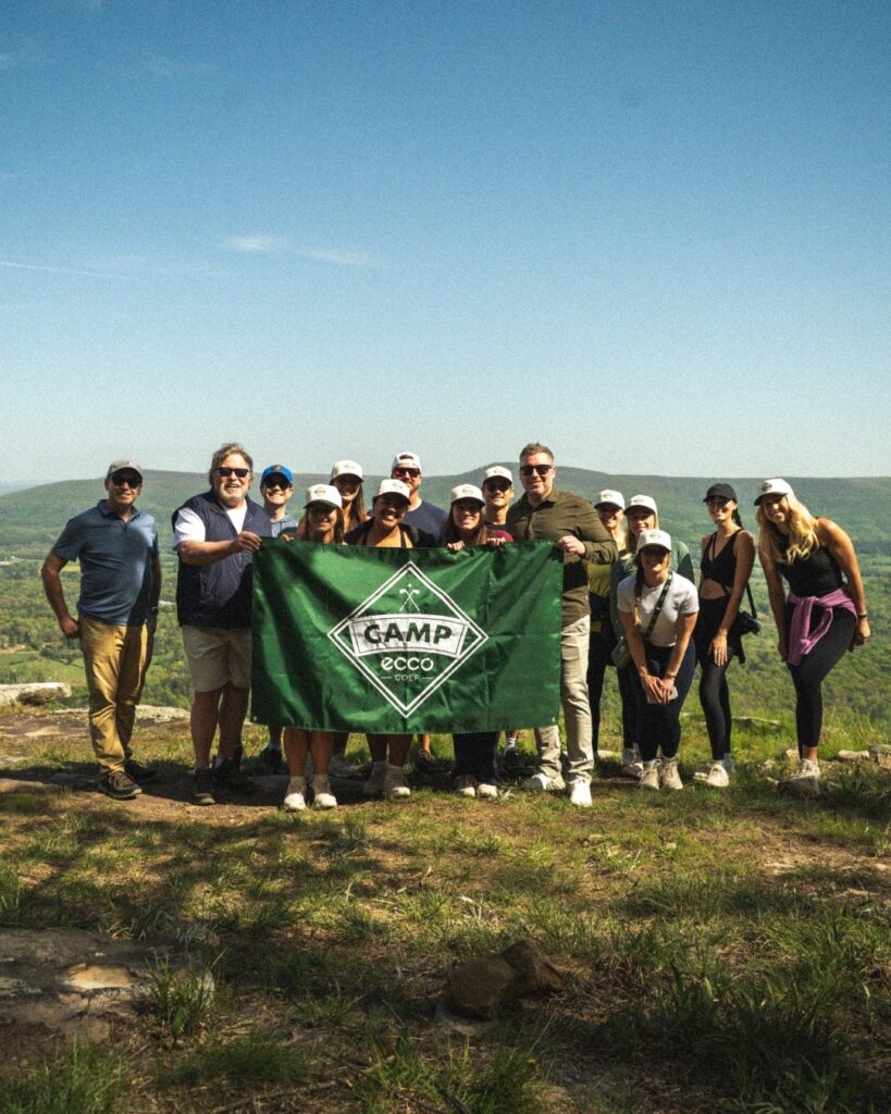 People standing with ecco sign